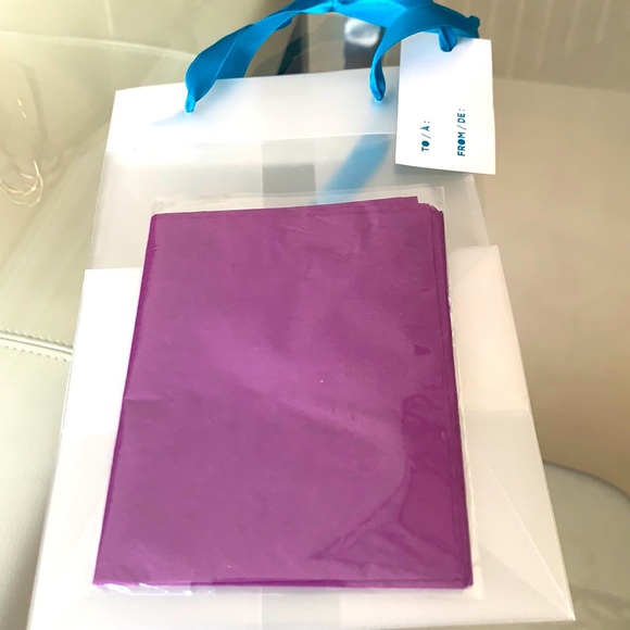 New gift bag with gift tag attached to the ribbon with purple tissue wrap.🎁 - Picture 1 of 3